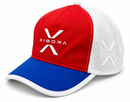 Casquette de padel XIBORA Terrain tricolore bleu, blanc et rouge, vue de trois quarts